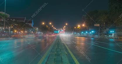 Hyperlapse of night city traffic on street intersection. Timelapse of cars and motorbikes movement.
