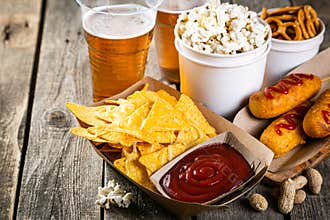 Selection of stadium game foods - nachos, pop corn, pretzels, corn dogs