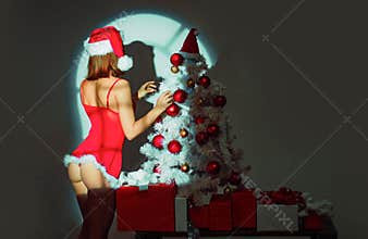 Christmas woman. Sexy erotic girl preparing to celebrate new year and merry christmas. Red lingerie for Christmas women
