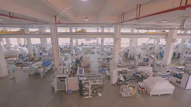 Panorama of a large modern machine-tool factory, a lot of people working in the factory