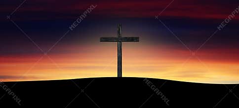 Cross silhouette at sunset sky