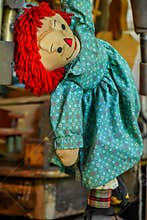 Vintage Raggedy Ann Doll hanging by arm
