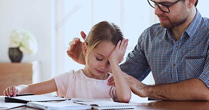 Caring dad support encourage sad tired child daughter studying together