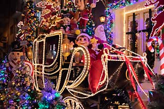 Christmas outside street decoration with lights, deer, presents, elves. Selective focus