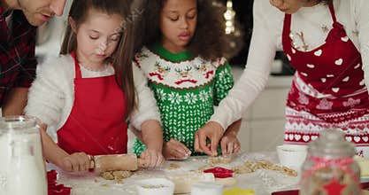 Family baking cookies for Christmas