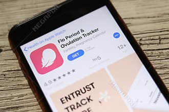 Phone with Flo Period and Ovulation Tracker logo on screen top view close-up. Los Angeles, California, USA - 9 November 2019,