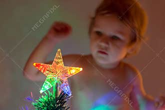 Christmas star attracts the attention of young children