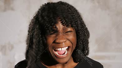 Emotional Afro American lady screams in anger and cries