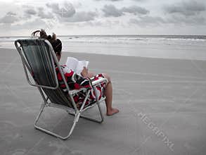 Reading a book in the beach