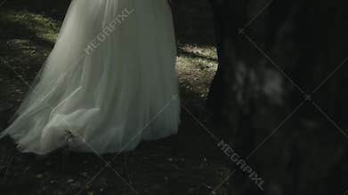 Women`s hem wedding dress.Hem of a female wedding dress. wedding dress in motion