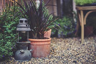 Vintage lamp. A garden decoration of an antique hand carried lamp