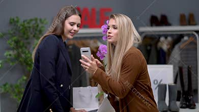 Shop assistant and customer in boutique