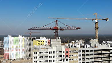 Construction site with cranes and high rise building under