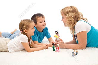 Woman telling a story to her kids on the floor