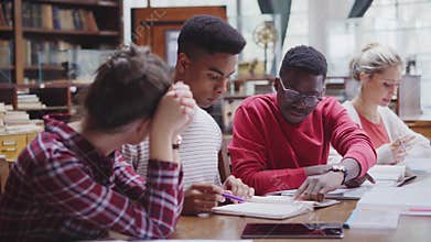 Group of university students studying together