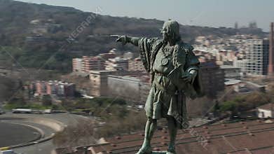 Aerial: close up circling Columbus monument in Barcelona, Spain on beautiful sunny day