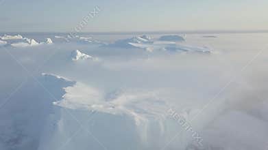 Icebergs drone aerial video top view - Climate Change and Global Warming - Icebergs from melting glacier in icefjord in Ilulissat.