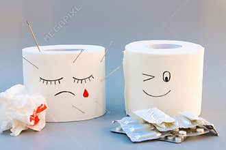 Toilet paper and pills. Concept of hemorrhoid treatment