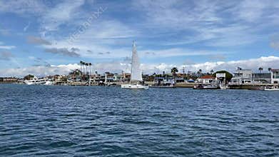 A sailboat on the water in Newport Beach, California