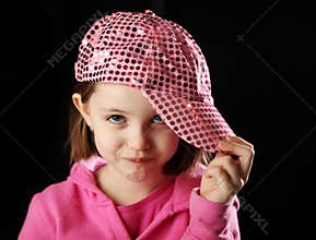 Female child wearing sparkly pink baseball cap