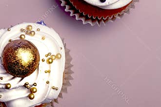 Sweet, colorful cupcakes decorated with sugar paste and cream. Concept of art paty. Flat lay, top veiw