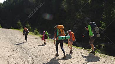 Family with children in  hike to the mountains