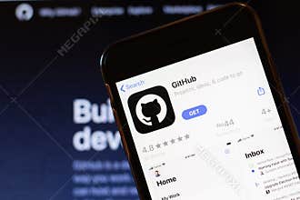 Los Angeles, California, USA - 24 March 2020: GitHub app logo on phone screen close up with website on background with icon,