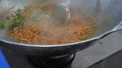 Cooking Aceh style noodles with added meat and seafood ingredients