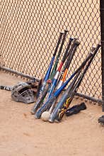 Baseball bats and fence.