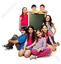 Large group of school kids and blackboard