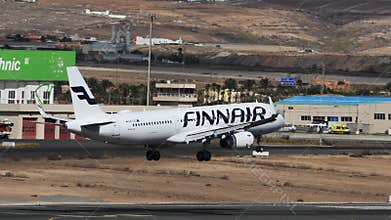 Airplane Landing Close Up. Airbus A321 Finnair in Canary Island Airport