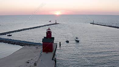 Aerial view of a beautiful beach and the Holland State Park during the sunset