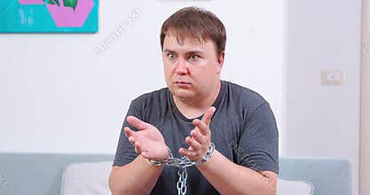 Guy was captured with chain or it was a friendly prank, front view.