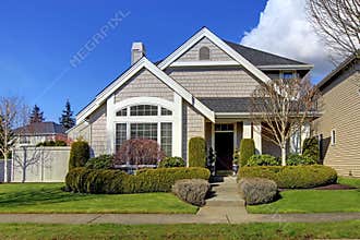 Classic new American house exterior in the spring.
