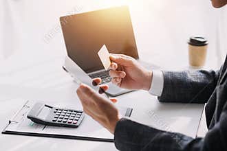 Close up of woman hand using credit card and laptop for payment and online shopping, Online shopping, payments digital banking, E-