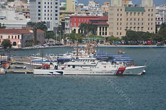 U.S. Coast Guard Ships Docked in Urban Harbor