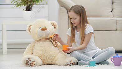 4k video of lovely kid playing with her soft bear