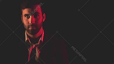 4k video of handsome man over black background