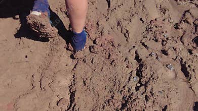 Thick Mud Builds Up on Hikers Shoes