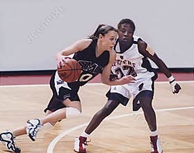 Jackie Stiles Drives on Karlita Washington in NCAA Tournament Basketball Contest in 2001