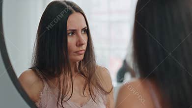 Disappointed girl checking pregnancy test. Lonely lady thinking about abortion