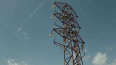 abandoned old rusty high voltage power supply line pylon with damaged wires, 4k