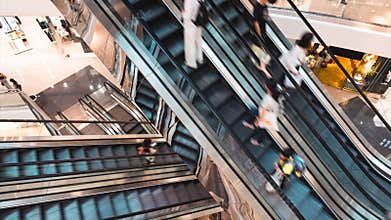Timelapse of Asian people customer transport on escalator at urban shopping mall in Hong Kong