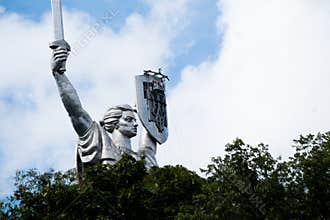 Kyiv, Ukraine - Aug 2023 : Motherland or Mother Ukraine monument. new replaced trident, Ukrainian national symbol, coat