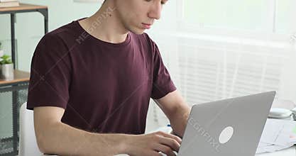 Responsible Office Worker Working with Laptop in the Office