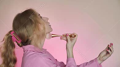 Woman doing pink makeup Barbie for party
