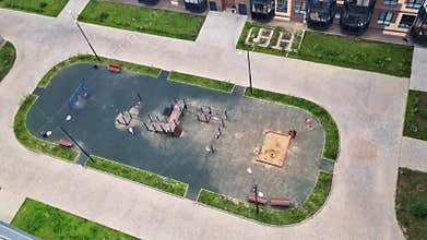 Areal footage of the kids on the playground. Outdoors