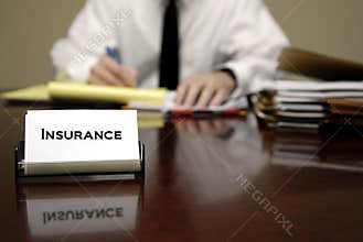 Insurance Man Sitting at Desk