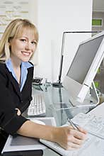 Young Financial Advisor Working In Office