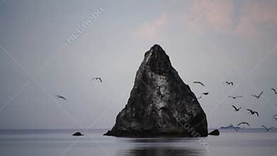 A flock of seagulls flying above the sea beach rocks in the background